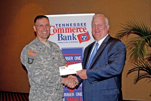 (Left to Right) Chaplain Thomas Faichney receives donation of $500 from Mike Sapp, Tennessee Commerce Bank Chairman/CDO.