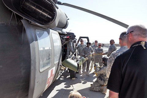 Task Force Currahee medics and Wilderness Instructor observe as a casualty is hoisted on a SKED-CO inside a medevac helicopter during the Wilderness Medicine class at Forward Operating Base Sharana, Afghanistan, May 14th. (Photo by U.S. Army Staff Sgt. Todd Christopherson, Task Force Currahee Public Affairs)