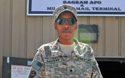 Spc. Salecha Sanders, the custodian of postal effects for the 90th Human Resources Company, 101st Special Troops Battalion, 101st Sustainment Brigade, stands outside the Bagram Post Office and headquarters for the 90th. As the COPE, she works in the position of a staff sergeant and is accountable for millions of dollars in equipment vital to guaranteeing service members in Afghanistan receive and send their mail. (Photo by Spc. Michael Vanpool)