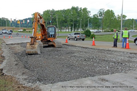 After filling and packing the area with dirt, the Clarksville Street Department is seen here filling the hole with gravel and preparing to reopen the lane on Cumberland Drive.