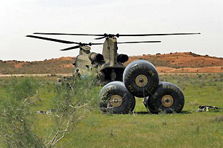Soldiers of the 159th Combat Aviation Brigade, 101st Airborne Division, discuss a plan of action to unload materiels necessary for moving the fuel blivets in the foreground during a forward arming and refueling point mission in southern Afghanistan, April 13th. (Photo by: Spc. Jennifer Andersson) Soldiers of the 159th Combat Aviation Brigade, 101st Airborne Division, discuss a plan of action to unload materiels necessary for moving the fuel blivets in the foreground during a forward arming and refueling point mission in southern Afghanistan, April 13th. (Photo by: Spc. Jennifer Andersson)