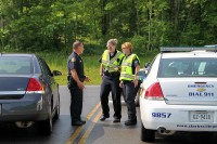 Officers talking with DC Gray at one of the entry control points. (Photo by CPD-Jim Knoll)