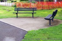 Benches along the walking path at Coy Lacy Park