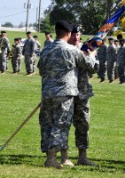 Col. Bill Gayler, 101st Combat Aviation Brigade commander, passes the 1st Battalion Colors to Lt. Col. William Ryan, 1st Battalion, 101st Aviation Regiment incoming commander, during a change of command ceremony at Fort Campbell, KY, June 23rd, 2011.