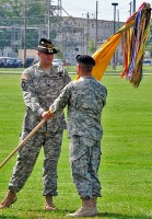 Lt. Col. Hank Taylor, 2nd Squadron, 17th Cavalry Regiment outgoing commander, passes the squadron colors to Col. Bill Gayler, 101st Combat Aviation Brigade commander, during a change of command ceremony June 21st, 2011 at Fort Campbell, KY. (101st Combat Aviation Brigade Public Affairs Noncommissioned Officer Tracy R. Weeden/Released)