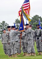 Lt. Col. John Kline, 5th Battalion, 101st Aviation Regiment outgoing commander, passes the battalion colors to Col. Bill Gayler, 101st Combat Aviation Brigade commander, during a change of command ceremony at Fort Campbell, KY, June 22nd. The incoming commander is Lt. Col. Christopher Waters.