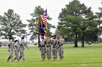 (Left to right) Lt. Col. Christopher Waters, 5th Battalion, 101st Aviation Regiment incoming commander, Maj. Elizabeth Martin, commander of troops and 5th Battalion executive officer, and Lt. Col. John Kline, the outgoing battalion commander, salute the colors during a change of command ceremony at Fort Campbell, KY, June 22nd.