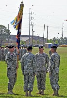 Command Sgt. Maj. Mark Lindsey, 6th Battalion, 101st Combat Aviation Brigade, prepares to pass the battalion colors to Lt. Col. Bradley Ninness, outgoing battalion commander, during a change of command ceremony June 20th, at Fort Campbell, KY.