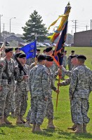 Command Sgt. Maj. Mark Lindsey, 6th Battalion, 101st Combat Aviation Brigade, passes the battalion colors to Lt. Col. Bradley Ninness, the outgoing battalion commander, during a change of command ceremony June 20th, at Fort Campbell, KY.