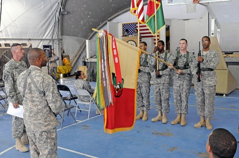 U.S. Army 1st Sgt. Terence Clay, the first sergeant of Headquarters and Headquarters Company, 101st Special Troops Battalion, 101st Sustainment Brigade, and Command Sgt. Maj. David Thompson, the 101st Sust. Bde. command sergeant major, inspect the brigade colors during a rehearsal for the brigade's birthday ceremony. (Photo by Spc. Michael Vanpool)