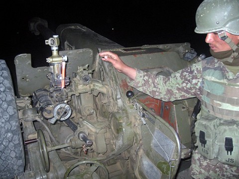 An Afghan National Army cannon crew member with 4th Kandak, 2nd Brigade, 203rd Corps, prepares for a fire mission during the battery’s first independent fire support mission June 12th-16th in Afghanistan’s Paktika Province. The battery provided support to 5th Kandak, 2nd BDE, 203rd Corps, as they conducted ground operations. (Courtesy Photo)