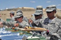 Soldiers from 4th Brigade Combat Team, 101st Airborne Division, Task Force Currahee, enjoy a barbecue while celebrating Memorial Day May 29th at Forward Operating Base Sharana in Paktika Province, Afghanistan. (U.S. Army photo by Sgt. Luther L. Boothe Jr., Task Force Currahee Public Affairs)