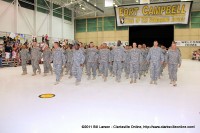 The soldiers march with their families cheering loudly