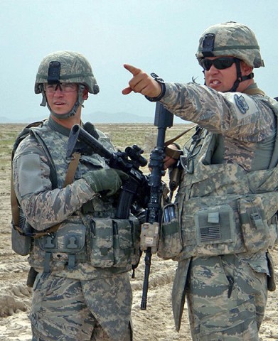 U.S. Air Force Staff Sgt. Vinny Estes from Pensacola, FL, left, talks with U.S. Air Force Staff Sgt. Wade Thompson from Springfield, TN, both members of the 455th Expeditionary Security Forces Squadron, April 14th outside Bagram Airfield, Afghanistan. (Courtesy Photo)