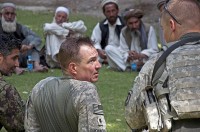 U.S. Army Lt. Col. William B. Johnson, commander, 1st Squadron, 61st Cavalry Regiment, Task Force Panther, 4th Brigade Combat Team, 101st Airborne Division, attached to 3rd Brigade Combat Team, 25th Infantry Division, Task Force Bronco, attends a meeting with Afghan leaders in the village of Memlah, Afghanistan, June 13th. (Spc. Hillary Rustine)