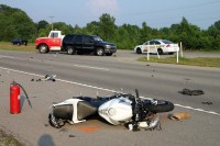 Honda motorcycle collided with the Tahoe, throwing the rider, and continued on without the rider to collided with a Nissan Versa. (Photo by CPD Jim Knoll)