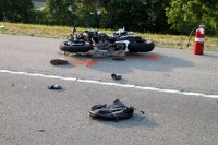 Honda motorcycle collided with the Tahoe, throwing the rider, and continued on without the rider to collided with a Nissan Versa. (Photo by CPD Jim Knoll)