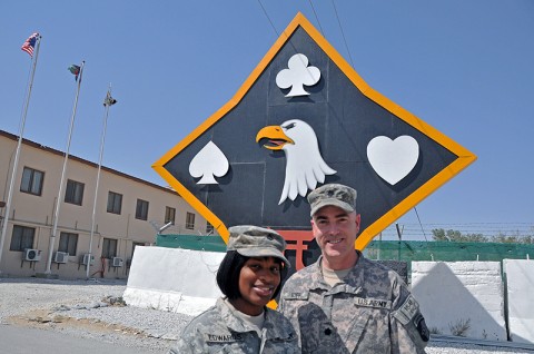 Pfc. Jasmine Edwards (left) and Lt. Col. Robert Eoff of the 101st Sustainment Brigade pose underneath the brigade “Deathstar” in Afghanistan. The two share a unique history Edwards’ mother was a squad leader under Eoff’s command early in his military career. (Photo by Sgt. 1st Class Peter Mayes)