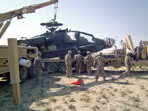 The joint recovery and distribution system is proving successful in vehicle recovery in Afghanistan. Here, soldiers with the 584th Maintainence Company, 142nd Combat Sustainment Support Battalion, 101st Sustainment Brigade, use the JRADS to recover a downed Apache helicopter. (Courtesy Photo)