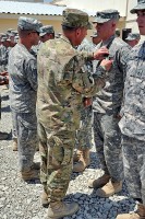 U.S. Army Gen. David H. Petraeus, commander of International Security Assistance Force and commander of U.S. Forces Afghanistan pins the Army Commendation Medal with Valor device on U.S. Army Pfc. Christopher W. Mioduszewski. (Photo by U.S. Army Sgt. Luther L. Boothe Jr., Task Force Currahee Public Affairs)