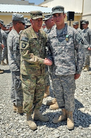 U.S. Army Gen. David H. Petraeus, commander of International Security Assistance Force and commander of U.S. Forces Afghanistan, pauses for a photo after pinning the Army Commendation Medal with Valor device on U.S. Army Pfc. James R. Morrison. (Photo by U.S. Army Sgt. Luther L. Boothe Jr., Task Force Currahee Public Affairs) U.S. Army Gen. David H. Petraeus, commander of International Security Assistance Force and commander of U.S. Forces Afghanistan, pauses for a photo after pinning the Army Commendation Medal with Valor device on U.S. Army Pfc. James R. Morrison. (Photo by U.S. Army Sgt. Luther L. Boothe Jr., Task Force Currahee Public Affairs)
