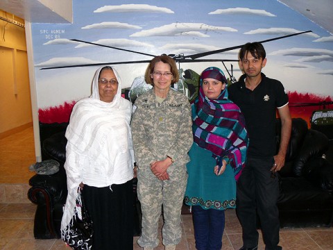 Chap. (Maj.) Tammie Crews, the brigade chaplain for the 101st Sustainment Brigade, stands with a local mother and daughter who work to progress gender equality in Afghanistan. The mother is involved in politics and the daughter is a school principal. Crews gave them around 60 donated boxes from several organization across the U.S. to distribute to the young girls at a local school in Kabul. (Courtesy Photo)