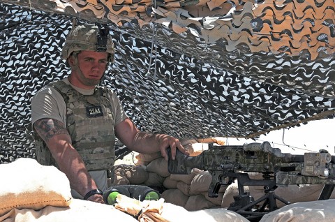 Spc. Ryan Grace, a Pathfinder with Company F, Task Force Wings (4th Battalion, 101st Aviation Regiment), pulls security at Battle Position Osman July 27th. IED emplacements and enemy attacks have significantly dropped in the area since the Pathfinders established the battle position nearly two months ago to increase security at Forward Operating Base Wolverine. (Photo by Sgt. Shanika Futrell)