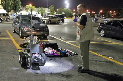 Deputy Mike King after inspecting the contents of the suitcases. (Photo by Jim Knoll-CPD)