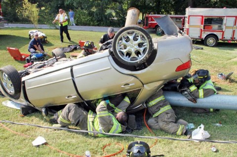 Extricating 2 year old. (Photo by CPD – Jim Knoll)