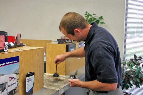 Detective Andy Hurst processing the crime scene.