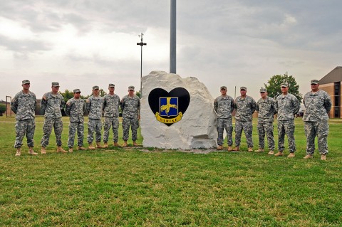 Soldiers with 2nd Brigade Combat Team, 101st Airborne Division (Air Assault), who served through four tours, stand beside Strike Rock, located near brigade headquarters at Fort Campbell, KY, earlier this month. The Soldiers were recognized during a ceremony for their multiple deployments in support of Strike Brigade’s missions. (U.S. Army Photo By Sgt. Joe Padula, PAO, 2nd BCT, 101st Abn. Div.)