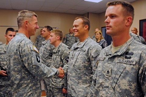 Maj. Gen. James McConville, commander, 101st Airborne Division (Air Assault), shakes the hand of Sgt. 1st Class Christopher Dorsey with the 101st’s 2nd Brigade Combat Team who has deployed with Strike four separate times. McConville addressed the Strike Soldiers who served through four deployments, during a ceremony at Fort Campbell, KY, earlier this month. (U.S. Army Photo By Sgt. Joe Padula, PAO, 2nd BCT, 101st Abn. Div.)