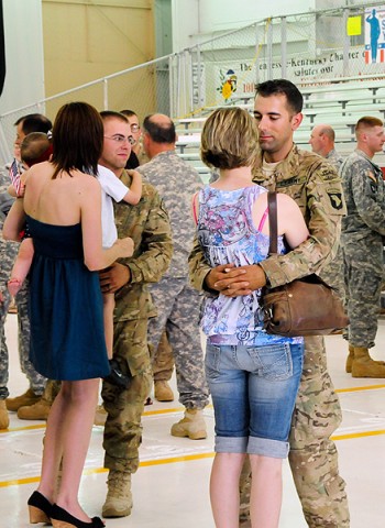 Dog Handlers with 2nd Brigade Combat Team, 101st Airborne Division (Air Assault), reunite with friends and family after a short welcome-home ceremony at Hanger Three at Fort Campbell Army Airfield, Fort Campbell, KY, September 15th. (U.S. Army Photo By Spc. Shawn Denham, PAO, 2nd BCT, 101st Abn. Div.)