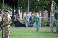 Soldiers of the 5th Special Forces Group (Airborne) present arms as the oldest and youngest Green Beret of the Group still living unveil a 9/11 display during a ceremony marking the 50th anniversary of the Group’s activation on September 21st, 1961. The display features two World Trade Center structural steel columns that were recovered from Ground Zero and presented to the unit by the Port Authority of both New York and New Jersey. (photo courtesy of Staff Sgt. Tobias McCoy)