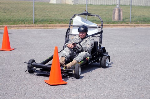 Pfc. James Powell, a satellite operator with Company C, 1st Special Troops Battalion, 1st Brigade Combat Team, 101st Airborne Division, drives head on into a cone after losing control of his vehicle. Powell participated in the Simulated Impaired Driving Experience course here, Sept. 1. SIDNE, a go-cart that simulates drunk driving, was featured at 1st BCT during Safety Stand-down Day to stress the importance for soldiers to stop drinking and driving. (Photo by Spc. Richard Daniels Jr.)