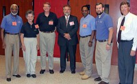 School Board members (from left) Horace Murphy, Jr., Eula Gardner Dowdy, George Giles, Chairman Jimmie Garland, Josh Baggett and Harris attended the Mid Cumberland District meeting in White House where the award was presented to Smith (center).