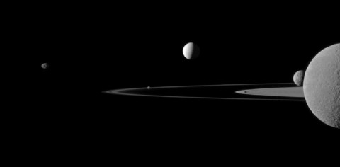 NASA's Cassini spacecraft captures five of Saturn's moons in one image: Janus, Pandora, Enceladus, Mimas and Rhea. This view looks toward the northern, sunlit side of the rings from just above the ringplane. Rhea is closest to Cassini here. The rings are beyond Rhea and Mimas. Enceladus is beyond the rings. (Image credit: NASA/JPL-Caltech/Space Science Institute)