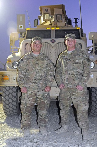 (L to R) Staff Sgt. James McCullough and his son Spc. Ryan McCullough. (Photo by Spc. Michael Vanpool)