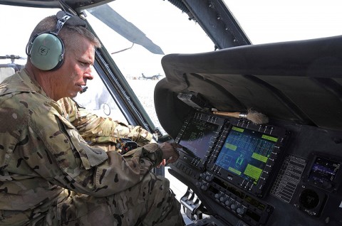 Chief Warrant Officer 4 Joel Sizelove, the production control officer in charge for Task Force Lift, checks the readouts from the integrated vehicle health management system on a UH-60M Black Hawk to determine, among other things, track vibrations in the rotors. IVHMS ultimately saves maintainers hours or even days of work and gets the aircraft and its crew back into the fight faster. (Photo by Jennifer Andersson, 159th Combat Aviation Brigade Public Affairs)