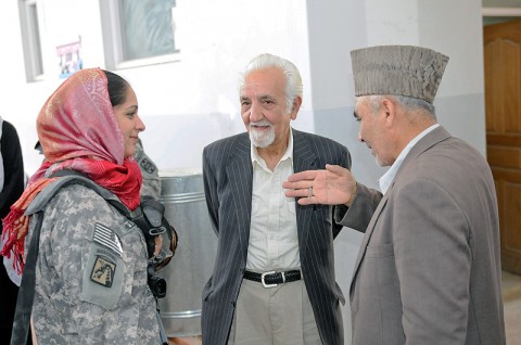 Sgt. 1st Class Christina Hill, the communications section noncommissioned officer in charge for the 530th Combat Sustainment Support Battalion, 101st Sustainment Brigade, talks with Wali Shah, the sub governor for the Dehdadi district after a monthly shura. The 530th CSSB meets monthly with the local government and village elders of Dehdadi to discuss ways to improve the region. (Photo by Spc. Michael Vanpool)