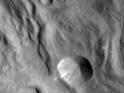 In this image of Vesta, taken by NASA's Dawn spacecraft just shortly before the beginning of high altitude mapping orbit, north is up and the upper right corner is to the northeast. The spacecraft's distance to Vesta's center is about 420 miles (680 kilometers), and the image resolution is approximately 65 meters per pixel. (Image credit: NASA/JPL-Caltech/UCLA/MPS/DLR/IDA)