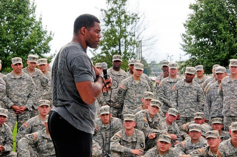 Herschel Walker, former NFL player and mixed martial arts fighter, speaks to Soldiers of 1st Battalion, 320th Field Artillery Regiment, 2nd Brigade Combat Team, 101st Airborne Division (Air Assault), at the Top Guns battalion’s headquarters at Fort Campbell, KY, Sept. 28th. Walker shared his personal struggle through mental health care problems, his rebound and recovery and encouraged Soldiers to seek help whenever it is needed. (U.S. Army Photo By Spc. Shawn Denham, PAO, 2nd BCT, 101st Abn. Div.)