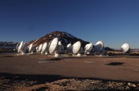 The Atacama Large Millimeter/submillimeter Array at its 16,500 ft elevation site in northern Chile. Still under construction, ALMA is the most powerful telescope of its kind in the world. At the time of this photo, 19 radio telescopes were in the array. Upon completion in 2013, 66 radio telescopes will fan over a nearly 100 square mile area. (W. Garnier, ALMA (ESO/NAOJ/NRAO))