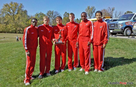 Austin Peay men's cross country team gathers around the championship trophy following its win at Kentucky Wesleyan, Saturday. APSU Cross Country. (Courtesy: Austin Peay Sports Information)