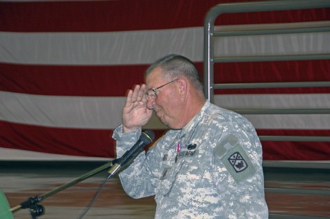 Command Sgt. Maj. Dennis Creecy delivers an emotional final salute to military friends on hand for his retirement ceremony last