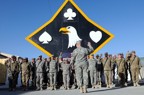 Col. Michael Peterman, the commander of the 101st Sustainment Brigade, re-enlists 31 of his soldiers in front of the brigade headquarters, October 2nd. Nearly 20 more Lifeliners re-enlisted at forward operating bases in Afghanistan and Iraq. (Photo by Spc. Michael Vanpool)