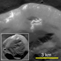 A fresh 15-km-diameter impact crater. Hollows are present on a section of the crater wall that has slid partway down toward the floor. (Courtesy of Science/AAAS) A fresh 15-km-diameter impact crater. Hollows are present on a section of the crater wall that has slid partway down toward the floor. (Courtesy of Science/AAAS)