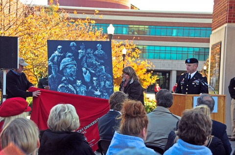 David and Cathy Yates, parents of fallen First Strike Soldier, 1st Lt. Eric Yates, a fire support officer for Company B, 1st Battalion, 502nd Infantry Regiment, 2nd Brigade Combat Team, 101st Airborne Division (Air Assault) and a 2008 Western Kentucky University Reserve Officers’ Training Corps graduate, unveil a granite mural with etched images of Eric during a Veteran’s Day ceremony held at Bowling Green, KY, Nov. 11th. (U.S. Army photo by Sgt. Joe Padula, 2nd BCT PAO, 101st Abn. Div.)