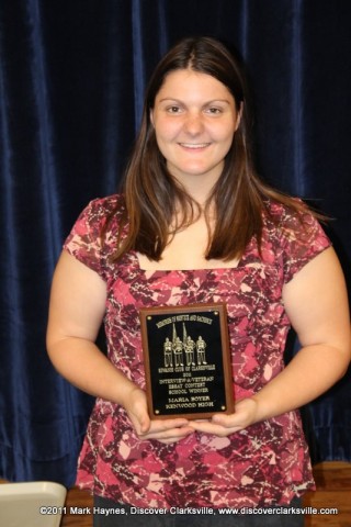 Maria Boyer receives an award at the Clarksville Kiwanis Club's Memories of Service and Sacrifice Project's "Interview a Veteran" essay contest.