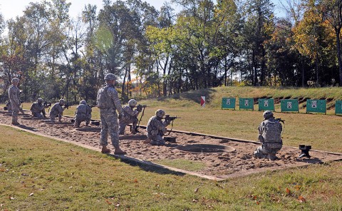 The 1st Brigade Combat Team fire support team soldiers qualify on their M4 carbine after having completed a 20 km ruck march Oct. 21st at Range 26. (Photo by Sgt. Jon Heinrich)